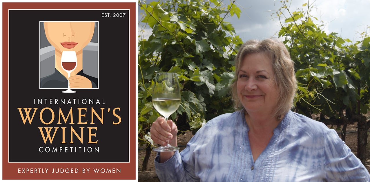 The International Women's Wine Competition poster next to a photo of Susan Tipton of Acquiesce Winery holding a glass of white wine in front of a leafy trellis.
