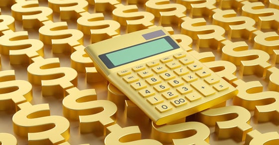 A golden calculator sitting on endless thick golden dollar symbols