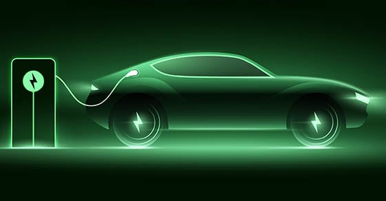 A stylized image of an electric car plugged into a charging station; everything is neon green