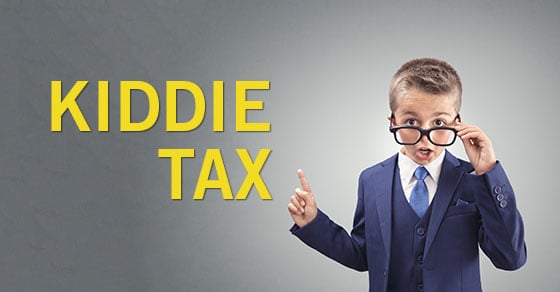 A young child wearing a business suit and large glasses looking surprised while pointing to the words "KIDDIE TAX"