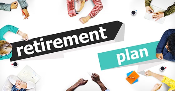 An overhead view of people sitting around a meeting table with the words "retirement plan" added to the image.