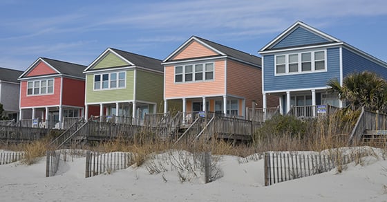An image of 4 beachside homes.